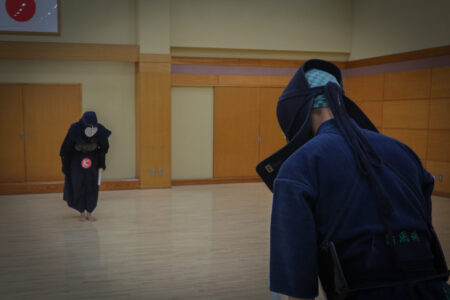 Practicing kendo reiho etiquette in a Tokyo training session