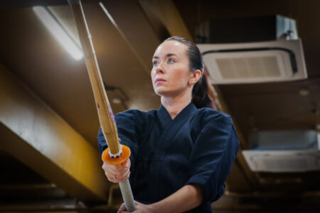 Kendo student concentrating during training in a Japanese dojo in Tokyo