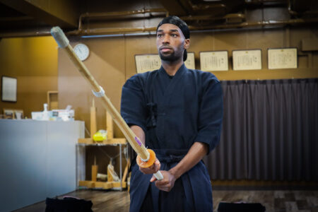 Focused kendo training in a Tokyo dojo with intense concentration