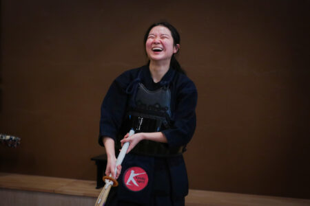 Participants laughing during a kendo experience in Tokyo