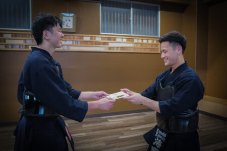 Participants sharing a happy moment after kendo session in Tokyo