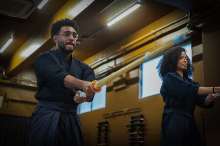 Kendo beginners learning techniques in a Tokyo dojo