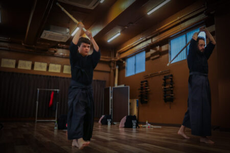 Participants learning kendo basics in Tokyo dojo